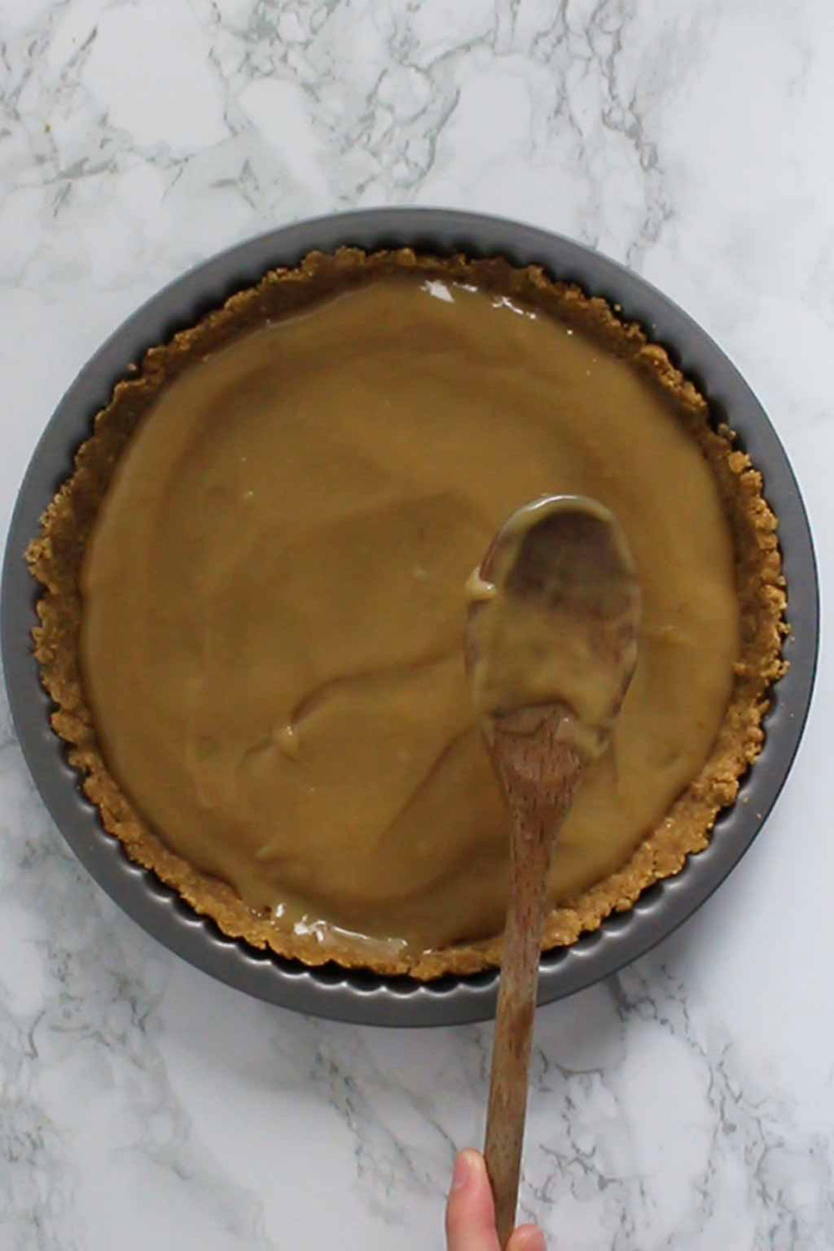 Spreading Dairy Free Caramel Onto Biscuit Base