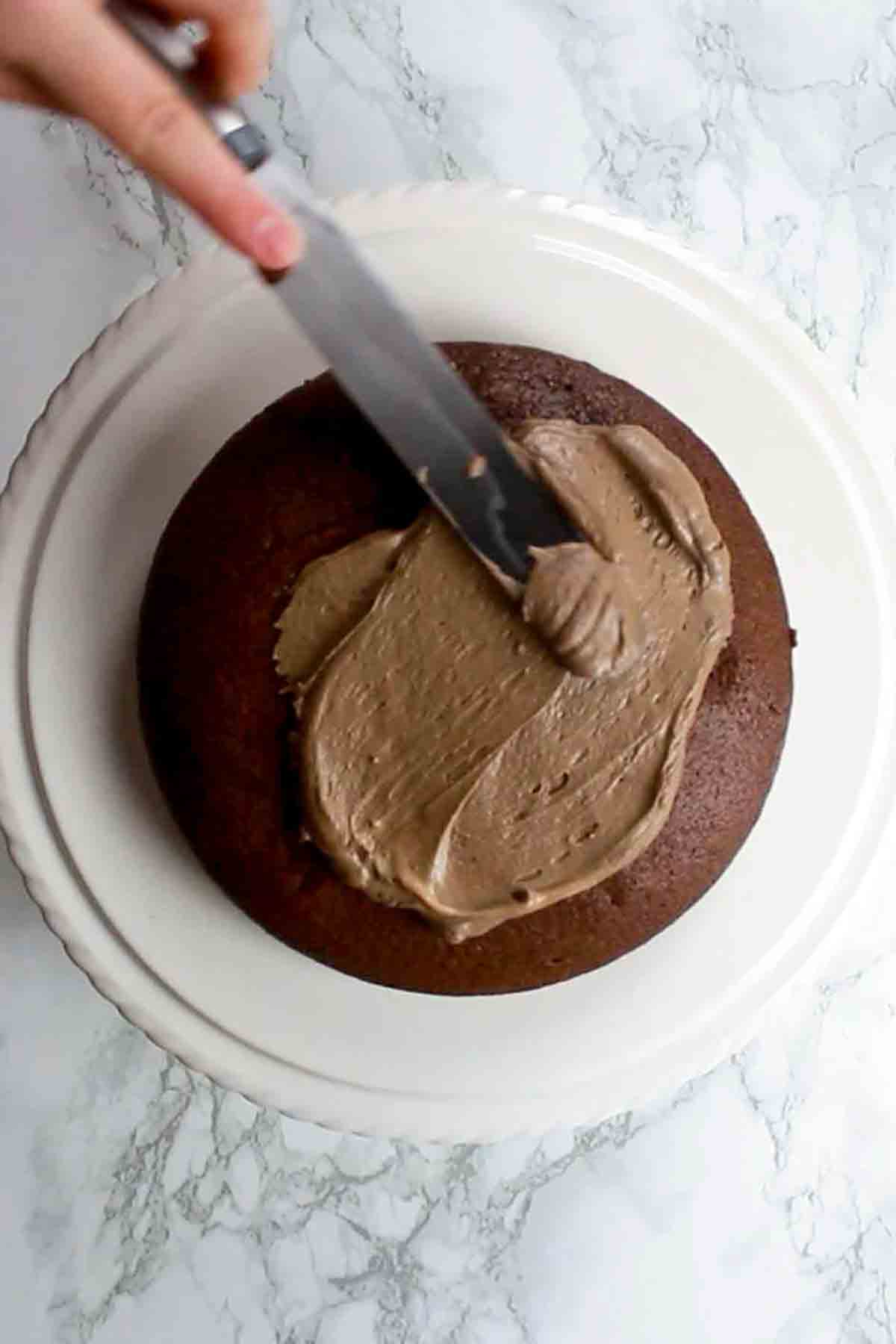 Spreading Icing Onto The Eggless Chocolate Cake