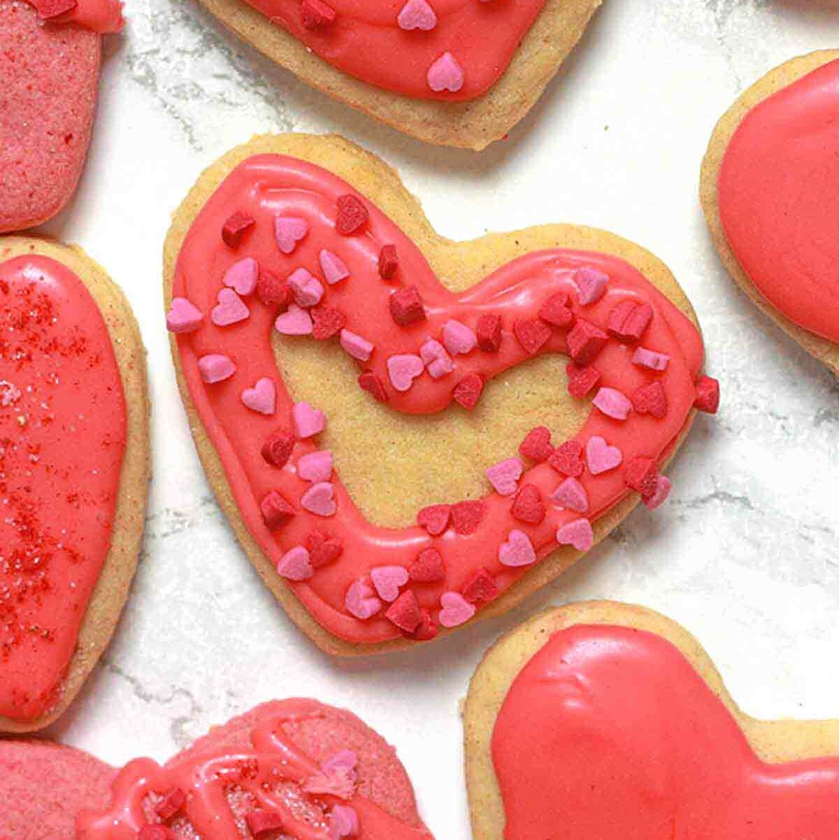 Heart shaped Vegan Valentines Cookies On A White Surface