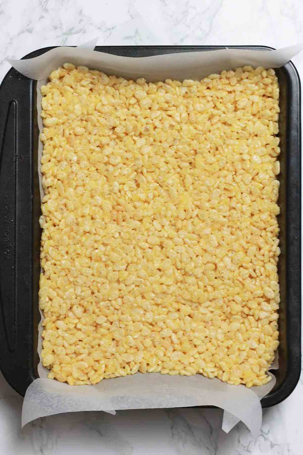 Vegetarian Rice Krispie Mixture Pressed Into A Lined Tin