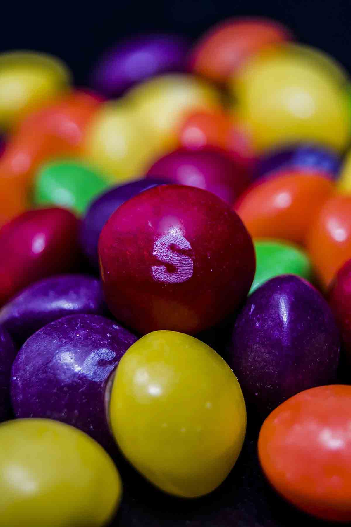 A Pile Of Different Coloured Skittles