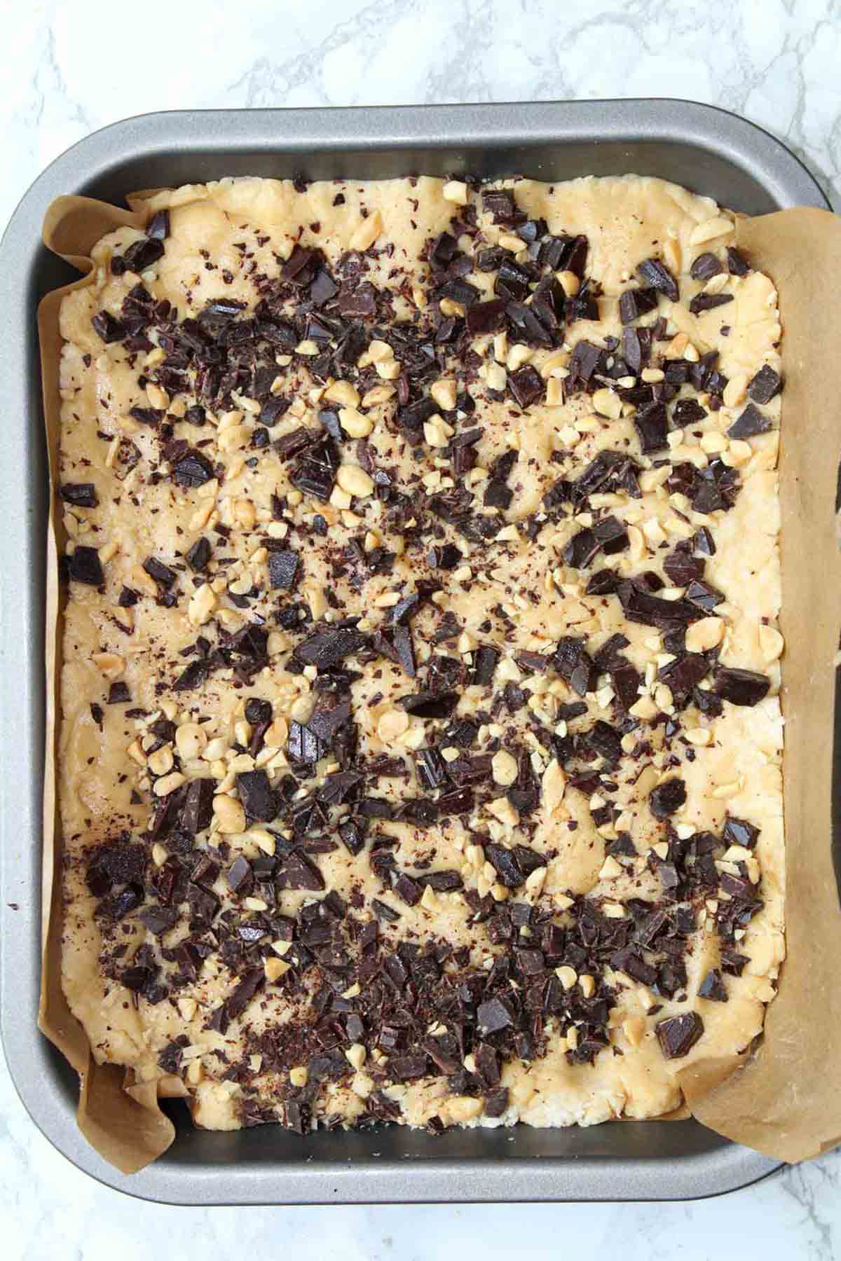 A Tray Full Of Dairy Free Peanut Butter Fudge With Chocolate On Top
