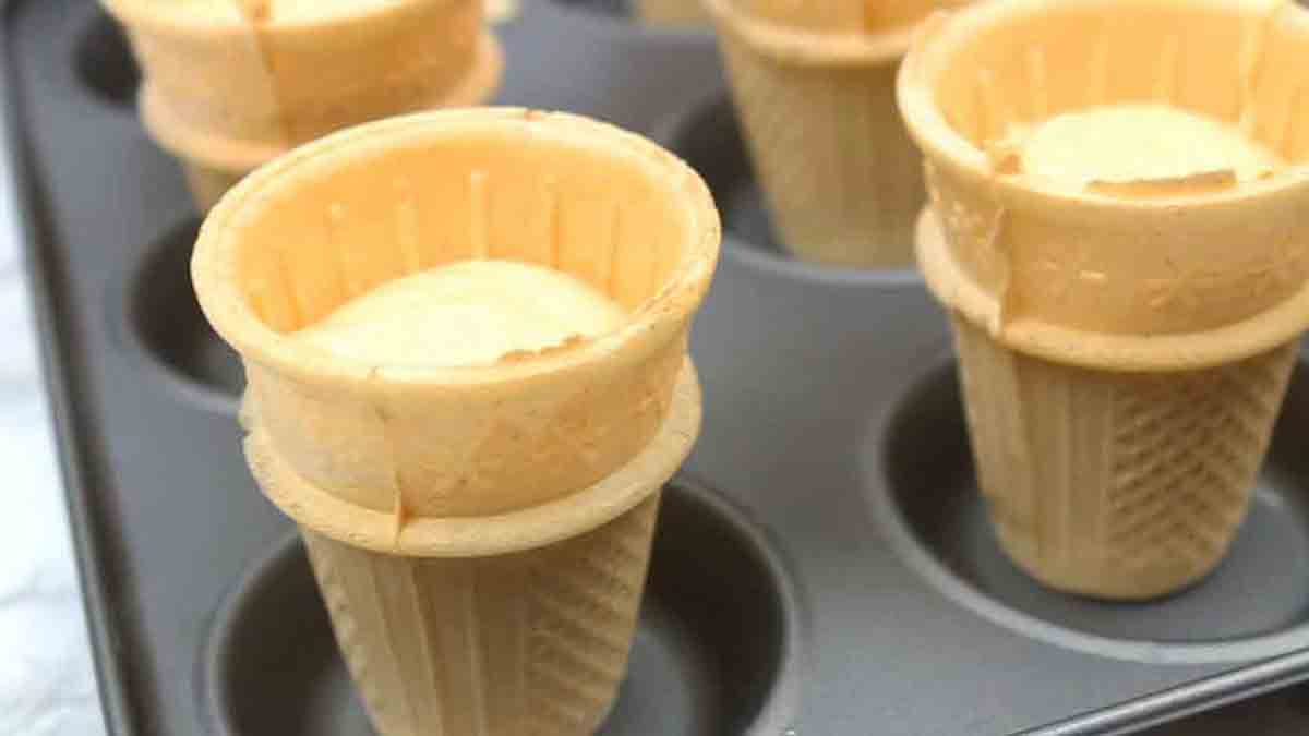 Cake Batter Inside Of Cones In A Cupcake Tin