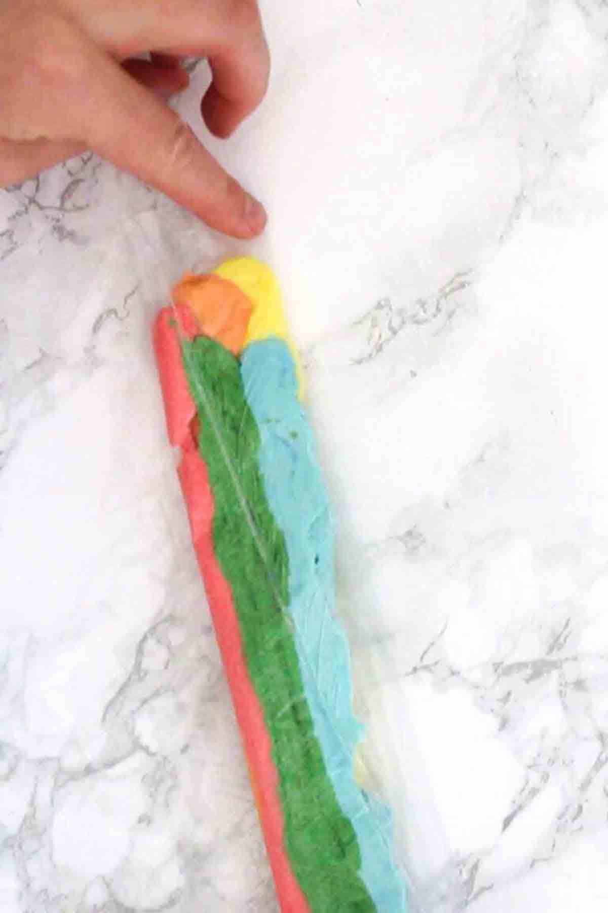 Folding Colourful Frosting In Piping Bags