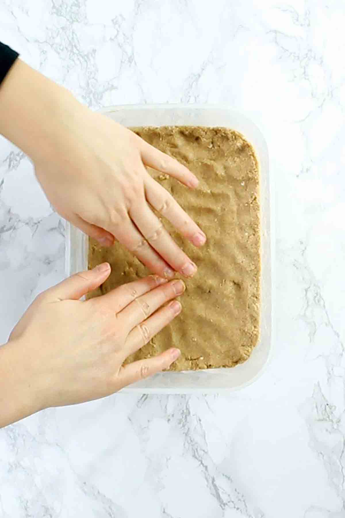 Pressing The Dough Into A Container
