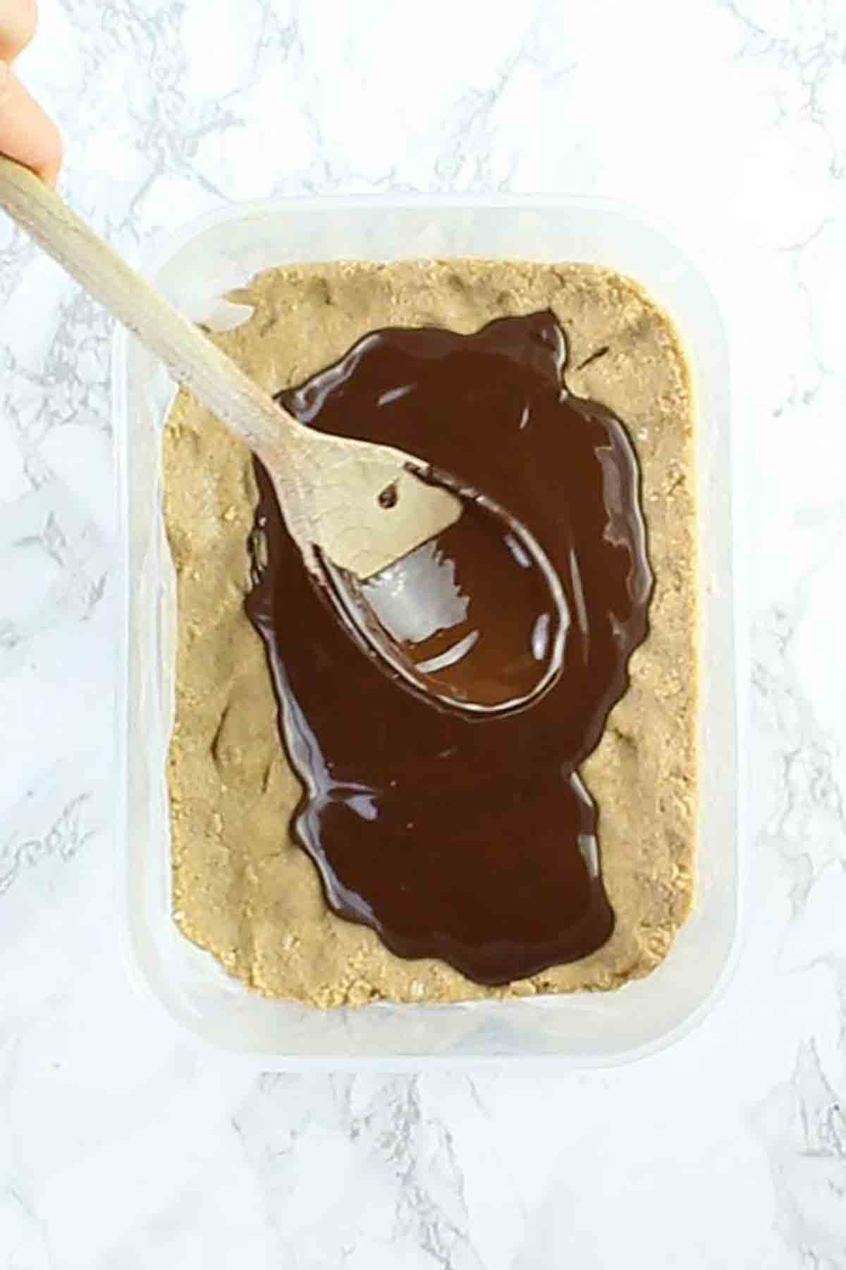 Spreading Dairy Free Chocolate Onto The Peanut Butter Base