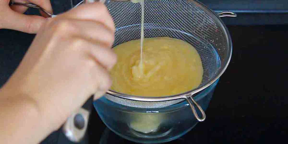 Straining The Lemon Curd Through A Sieve