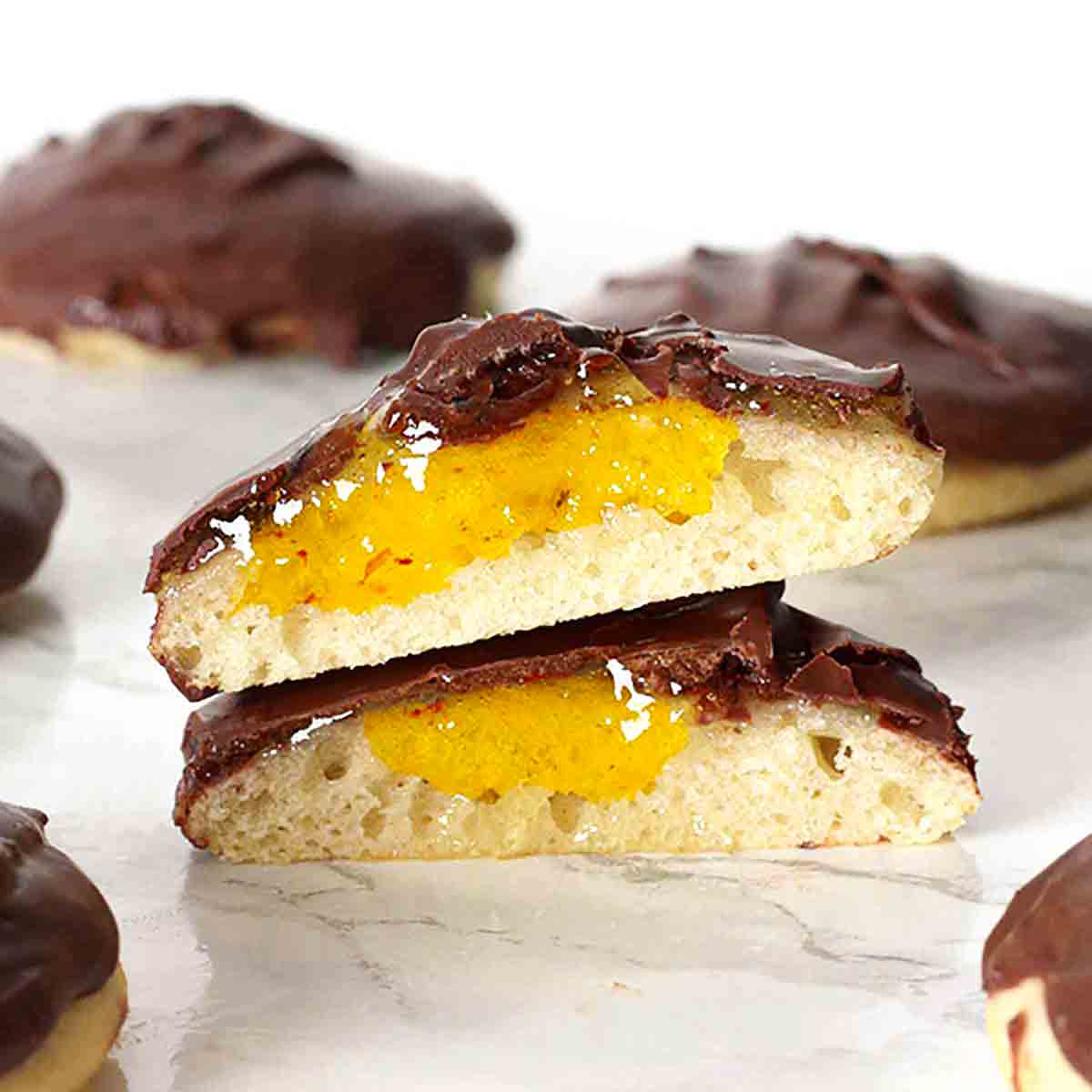 Two Halves Of Vegan Jaffa Cakes filled with marmalade