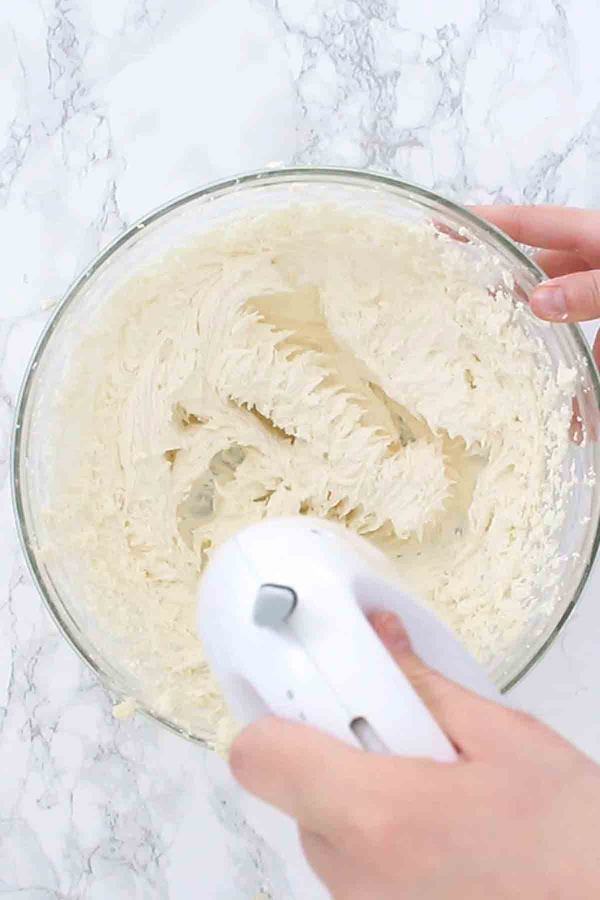 Whisking The White Buttercream In A Bowl