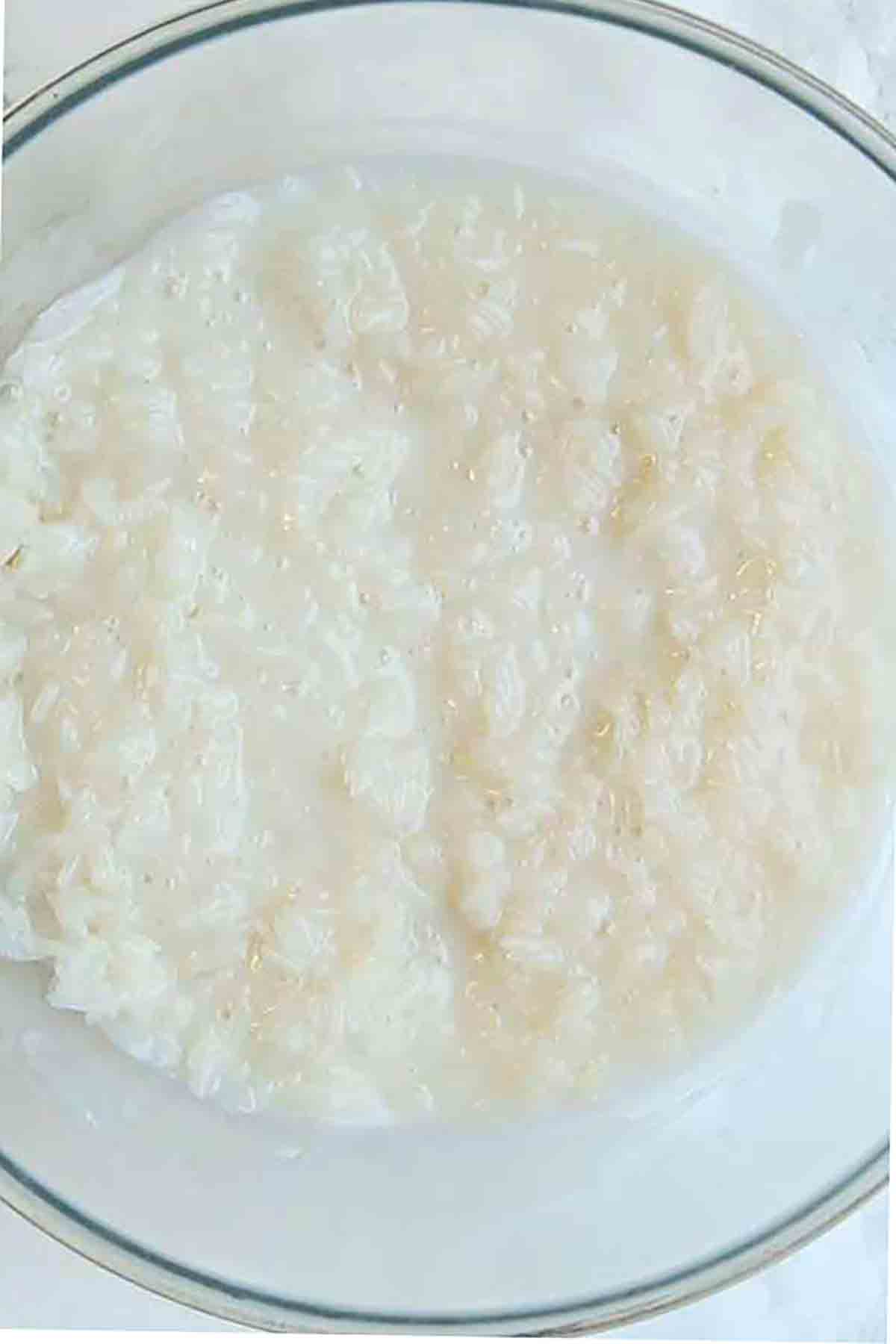 Rice And Coconut Milk Together In A Bowl