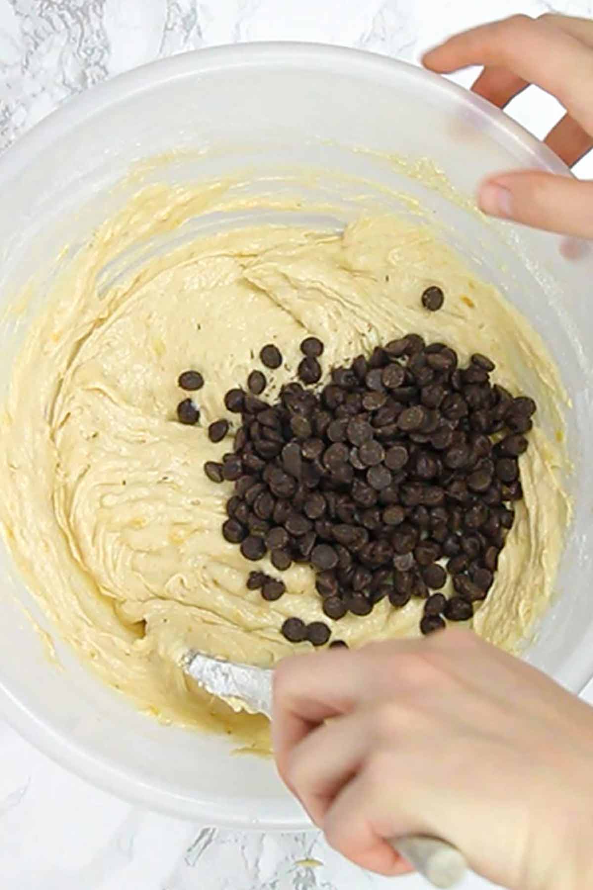 Adding Chocolate Chips To The Banana Bread Batter