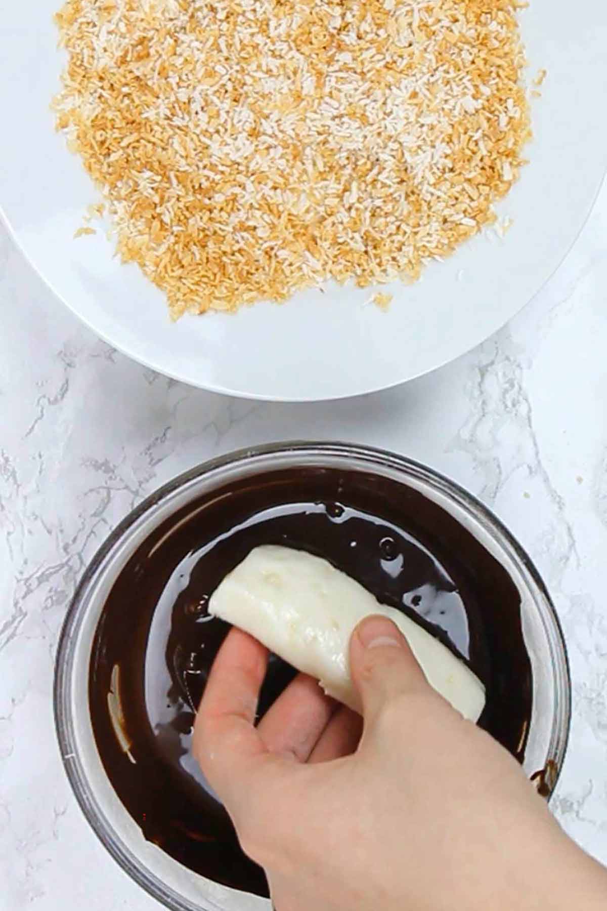 Dipping The Fondant Bar Into Melted Chocolate