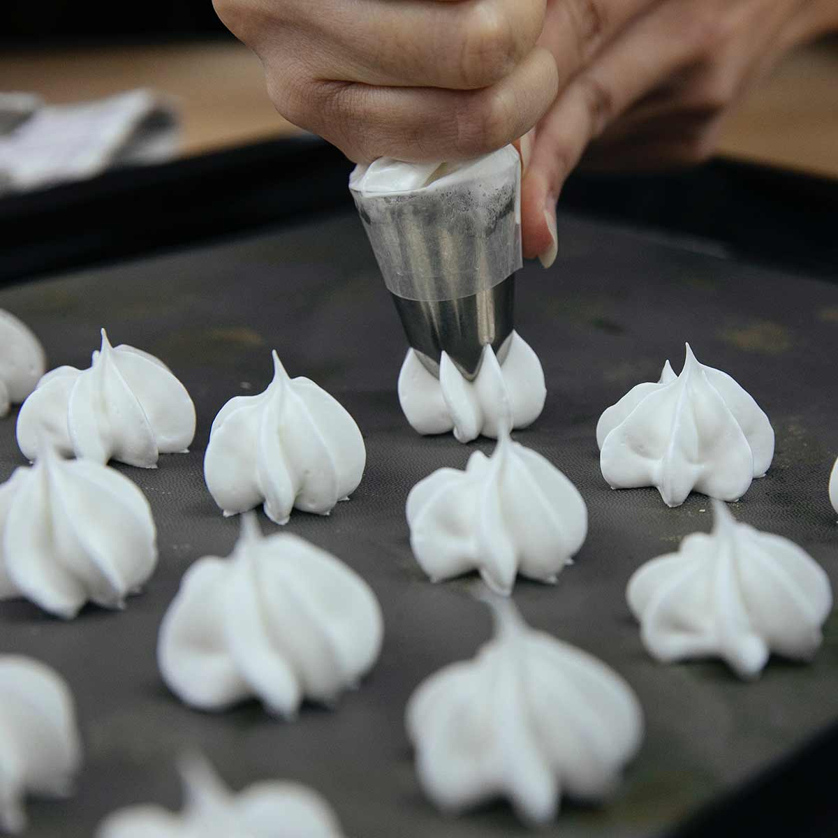 Piping Meringue Mixture Onto A Baking Tray