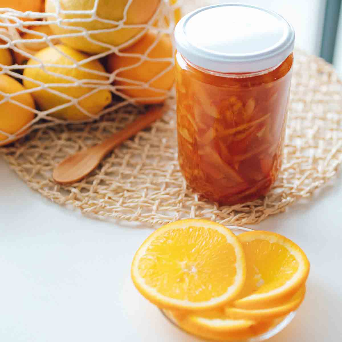 Is Marmalade Vegan  Jar Of Marmalade Alongside Orange Slices