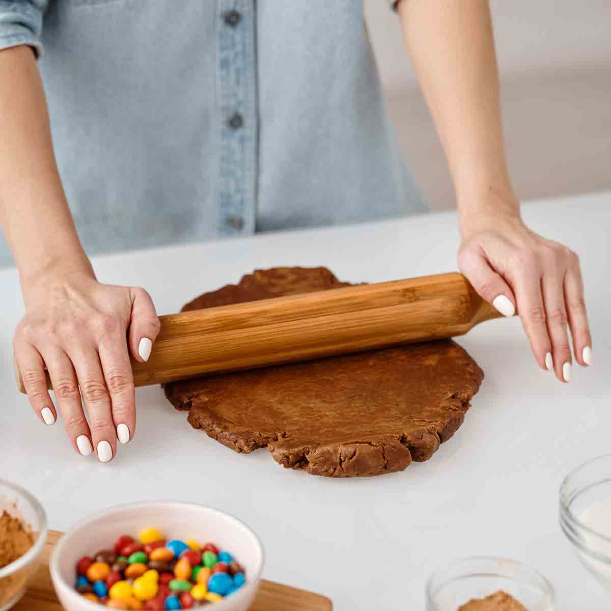 Rolling Flat Vegan Cookie Dough On A White Surface