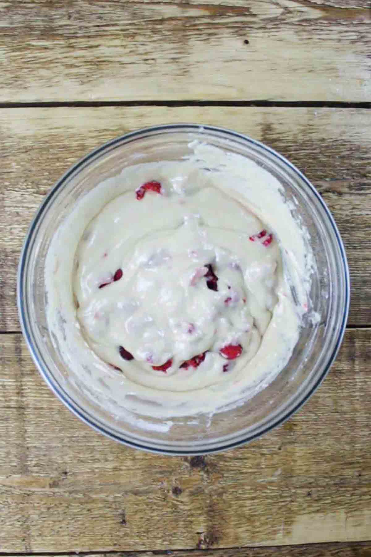 Bowl Of Muffin Batter With Raspberries In It