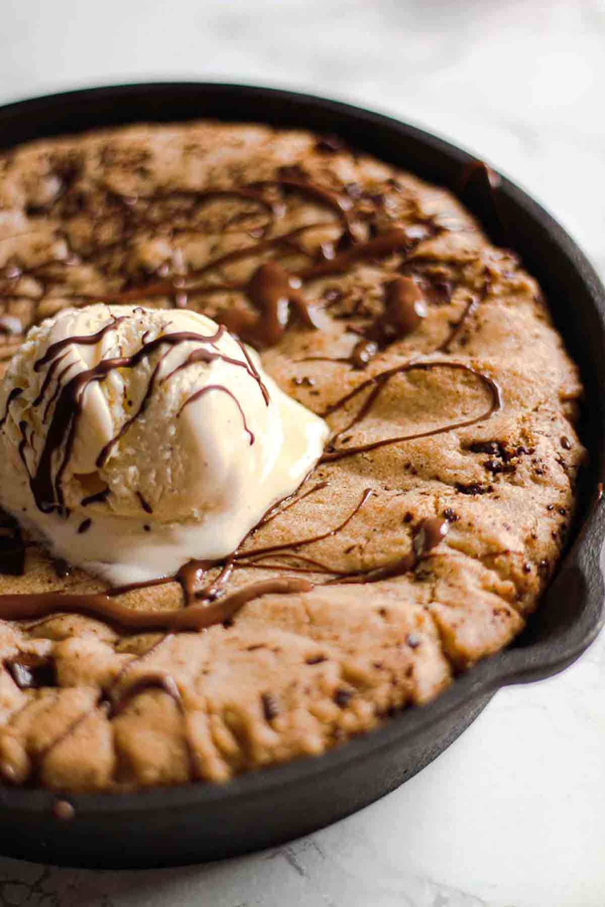 Close Up Of Vegan Hot Skillet Cookie Dough With Dairy Free Ice Cream On Top