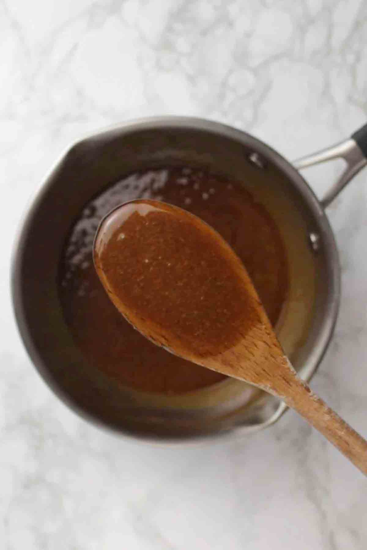 Image Of Vegan Biscoff Caramel On A Wooden Spoon