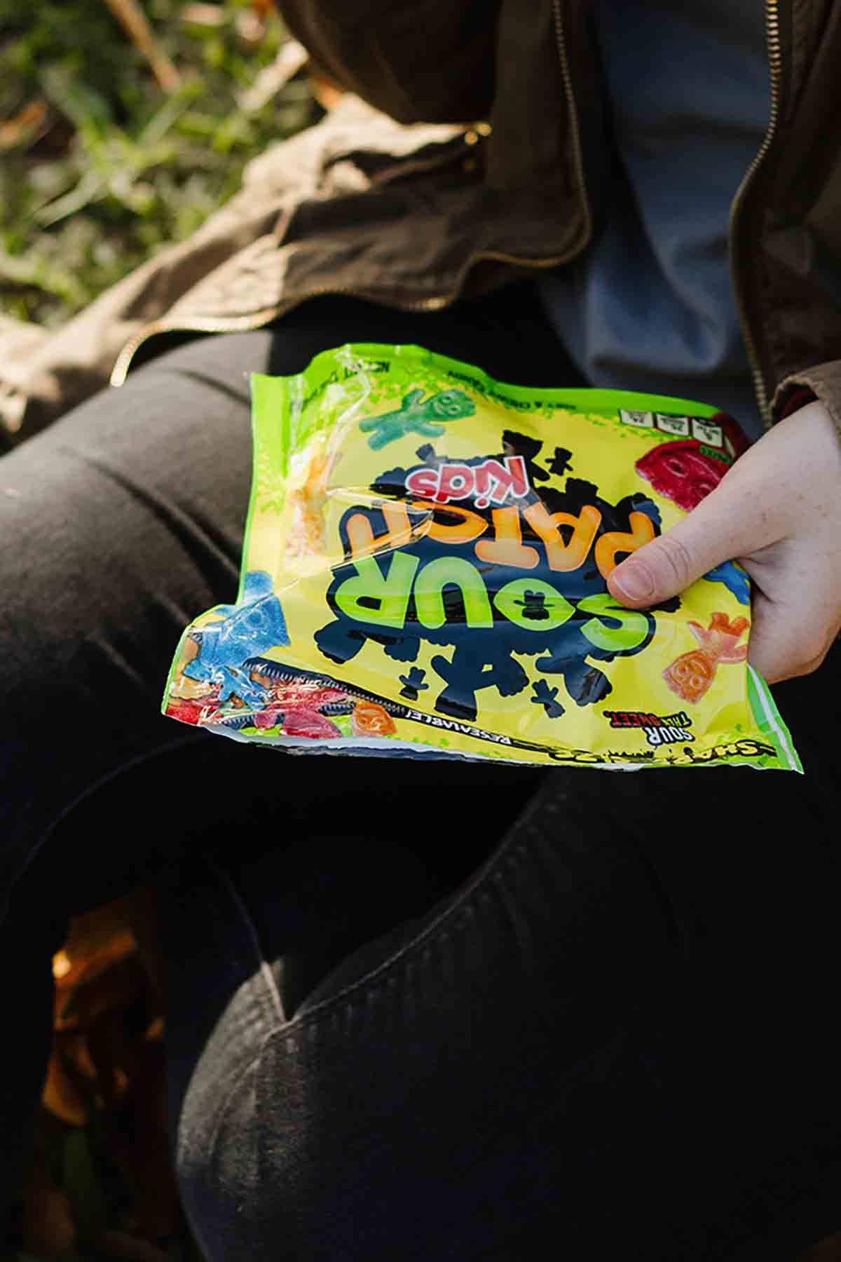 Person Holding Bag Of Sour Patch Kids