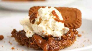 Slice Of Vegan Sticky Biscoff Pudding With Dairy Free Ice Cream On Top
