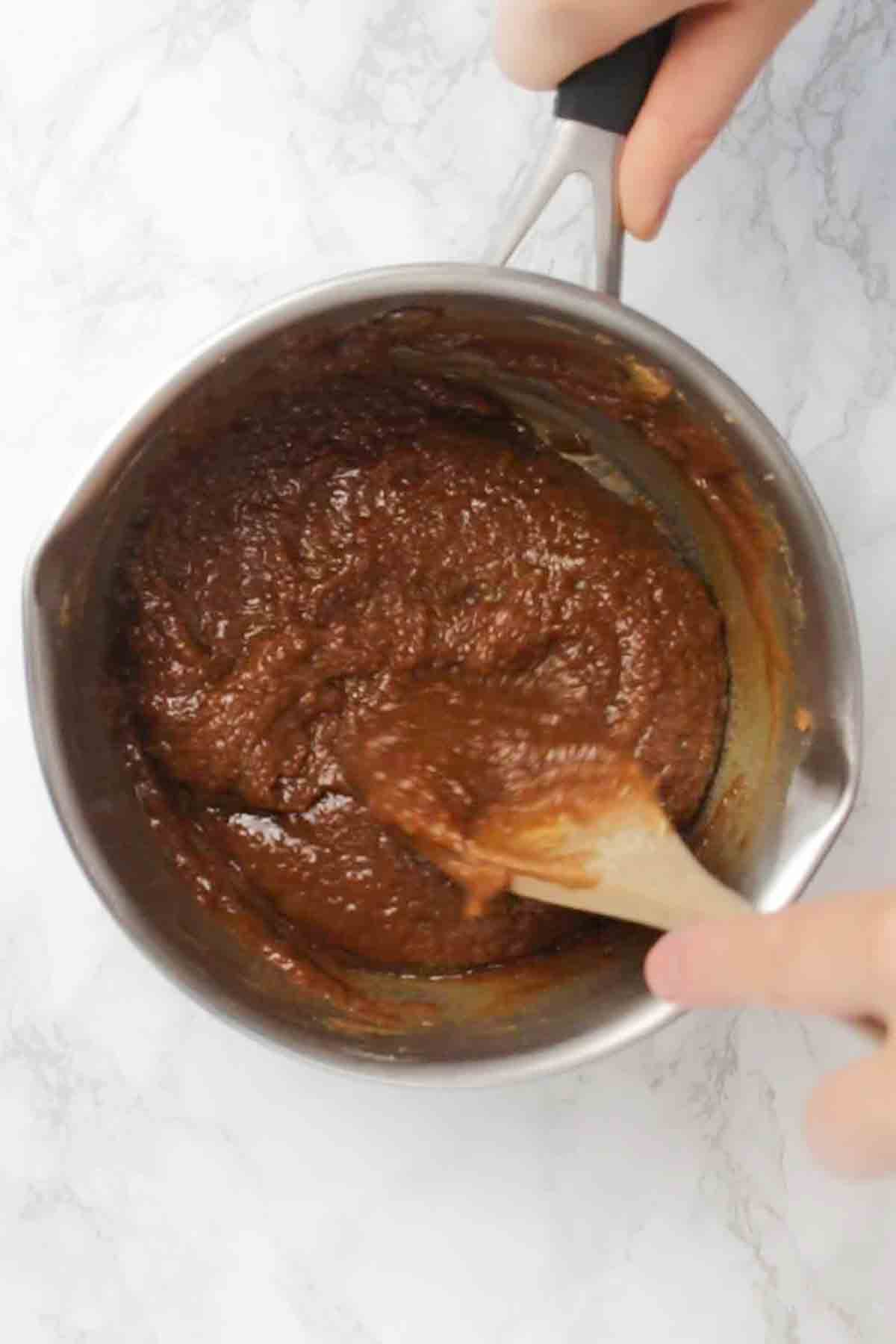 Wet Biscoff And Brown Sugar Mixture In A Pan