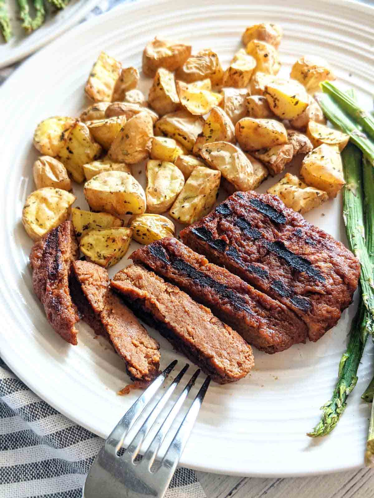 Sliced Vegan Steak And Potatoes
