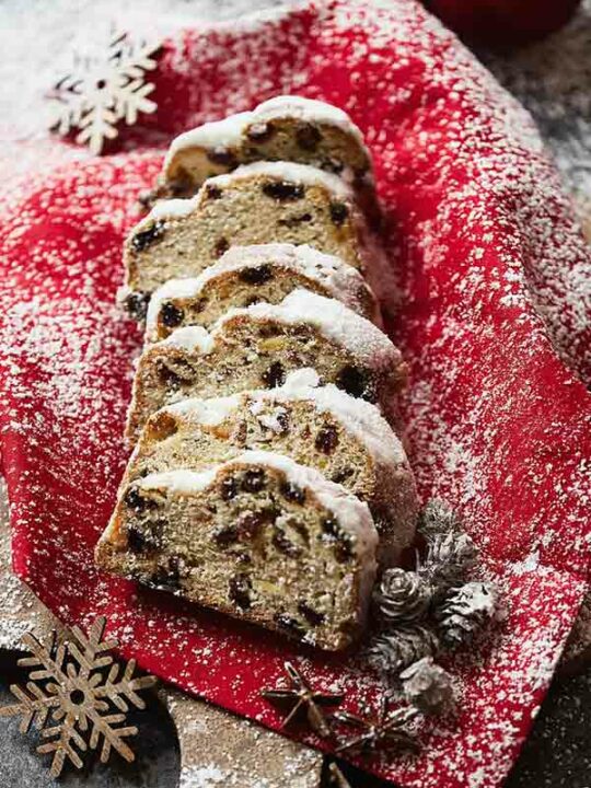 Is Stollen Vegan Thumbnail Image Of Slices on Christmas cloth