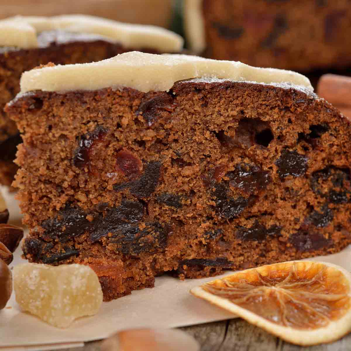 A Slice Of Christmas Cake With Icing On Top