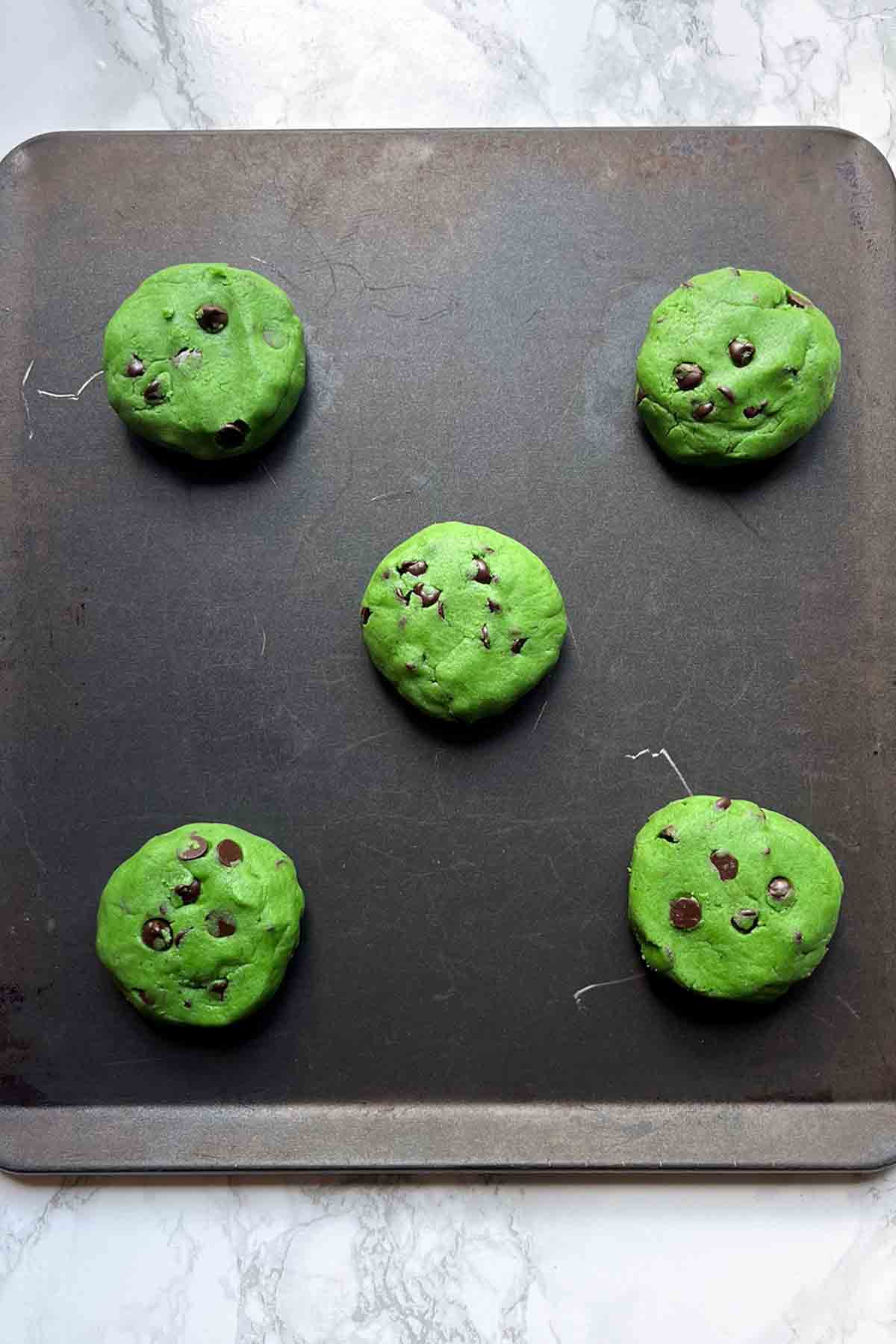 Balls Of Green Cookie Dough On A Tray