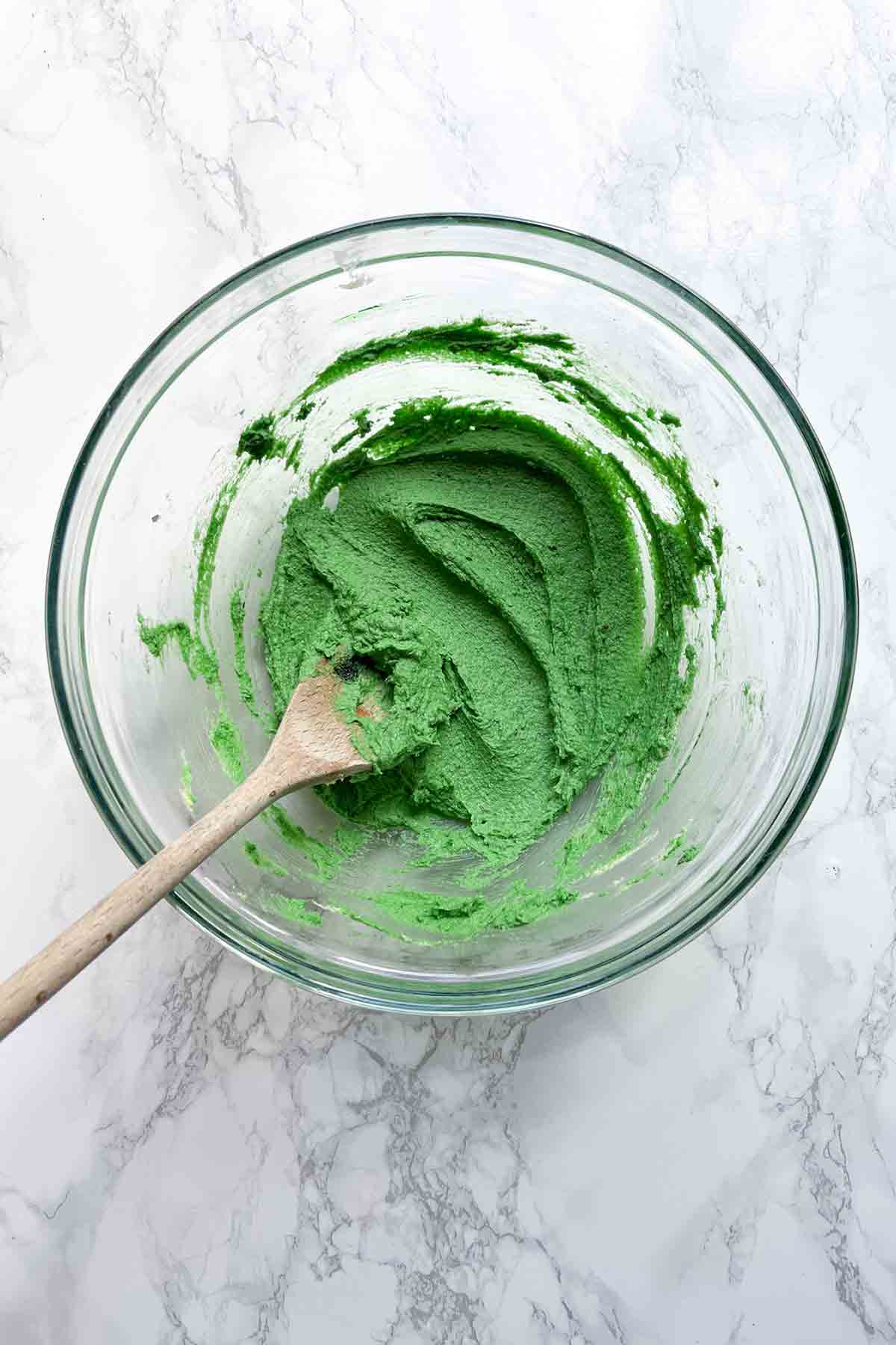 Butter And Sugar Mixed With Green Food Colouring In A Bowl