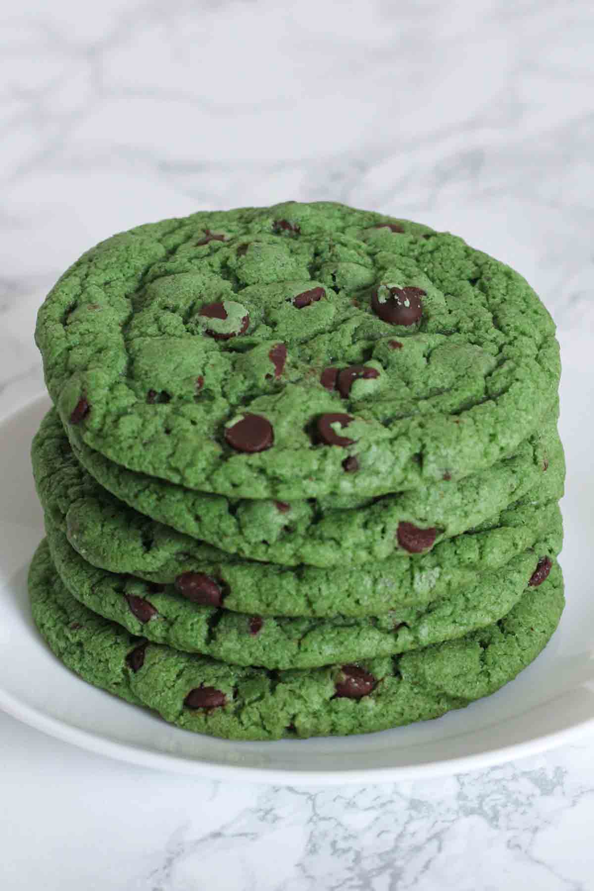 Stack Of 5 Vegan Mint Chocolate Chip Cookies On A Plate